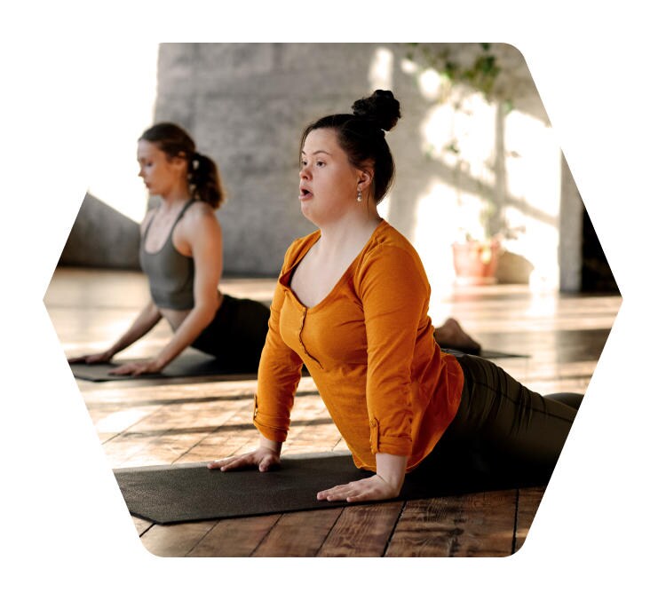 Two women practicing yoga