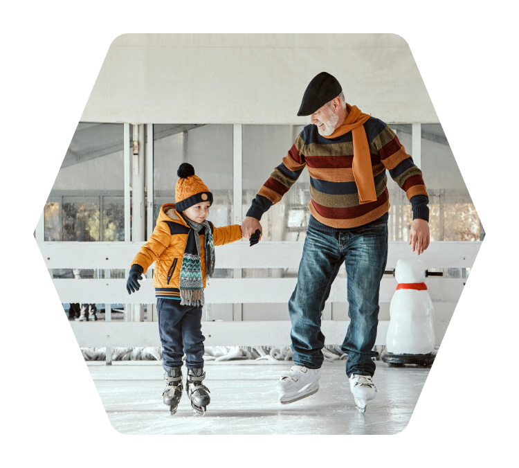 Grandfather skates with her granddaughter